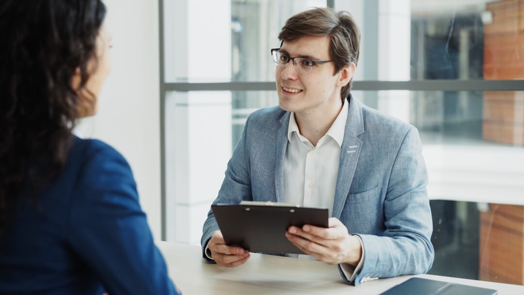 Two professionals conducting an interview practice session